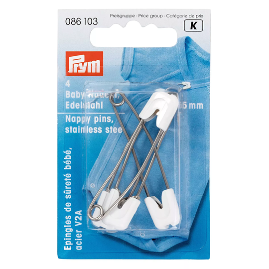 Verpackung mit vier Prym Sicherheitsnadeln aus Edelstahl mit weissem Kunststoffkopf, liegend auf einem hellblauen Stoffhintergrund image number