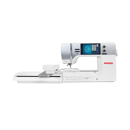 BERNINA 735 sewing and embroidery machine front view with embroidery module, showing large touchscreen and extended white sewing surface. image number