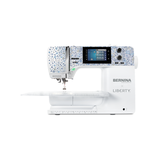 BERNINA 495 LE sewing machine front view with slide-on table, decorative blue panel and color touchscreen for quilting and creative sewing image number