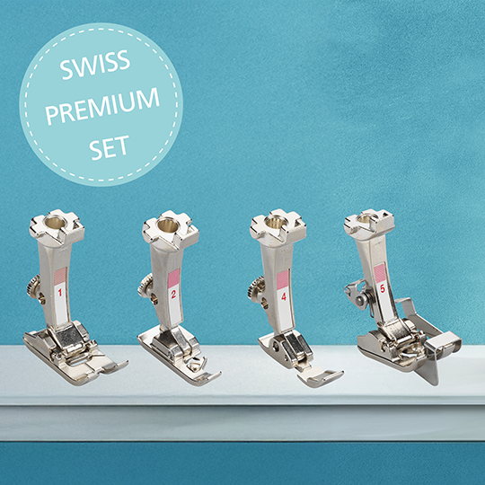 Set of four BERNINA presser feet in a Swiss Premium Set, neatly arranged in a row against a blue background for sewing and quilting. image number